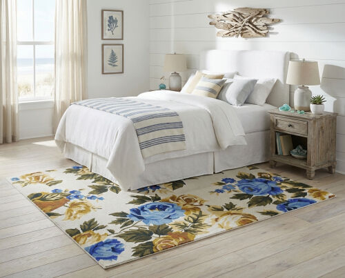 Rizzy Rumi Hand-tufted wool loop pile rug with floral pattern